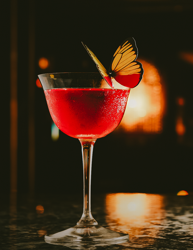 Cocktail with butterfly at the Dandy Bar at The Mayfair Townhouse