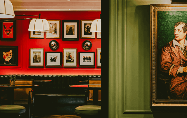 Seating area and portrait on The Lower Ground at The Mayfair Townhouse