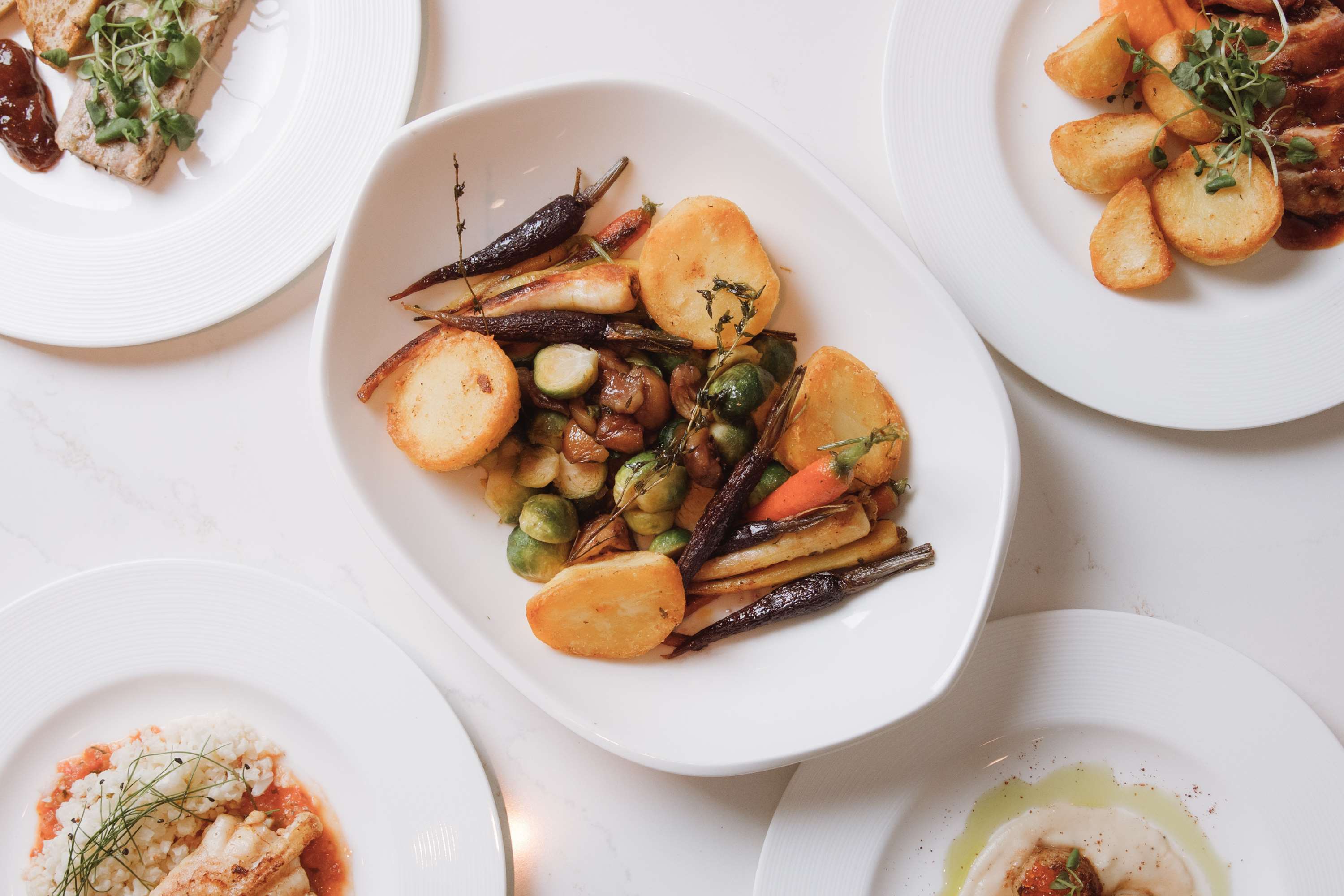 Festive Dinner Dishes Displayed on a white linen table