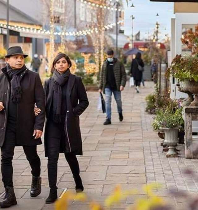Couple walking in Bicester Village