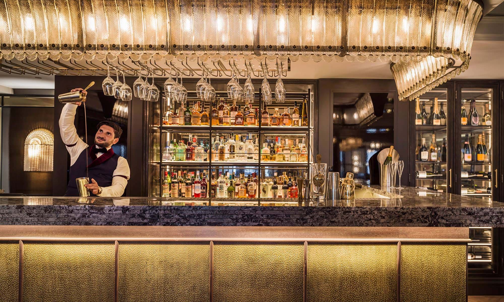 Mixologist at the bar in The Dandy Bar at The Mayfair Townhouse in London
