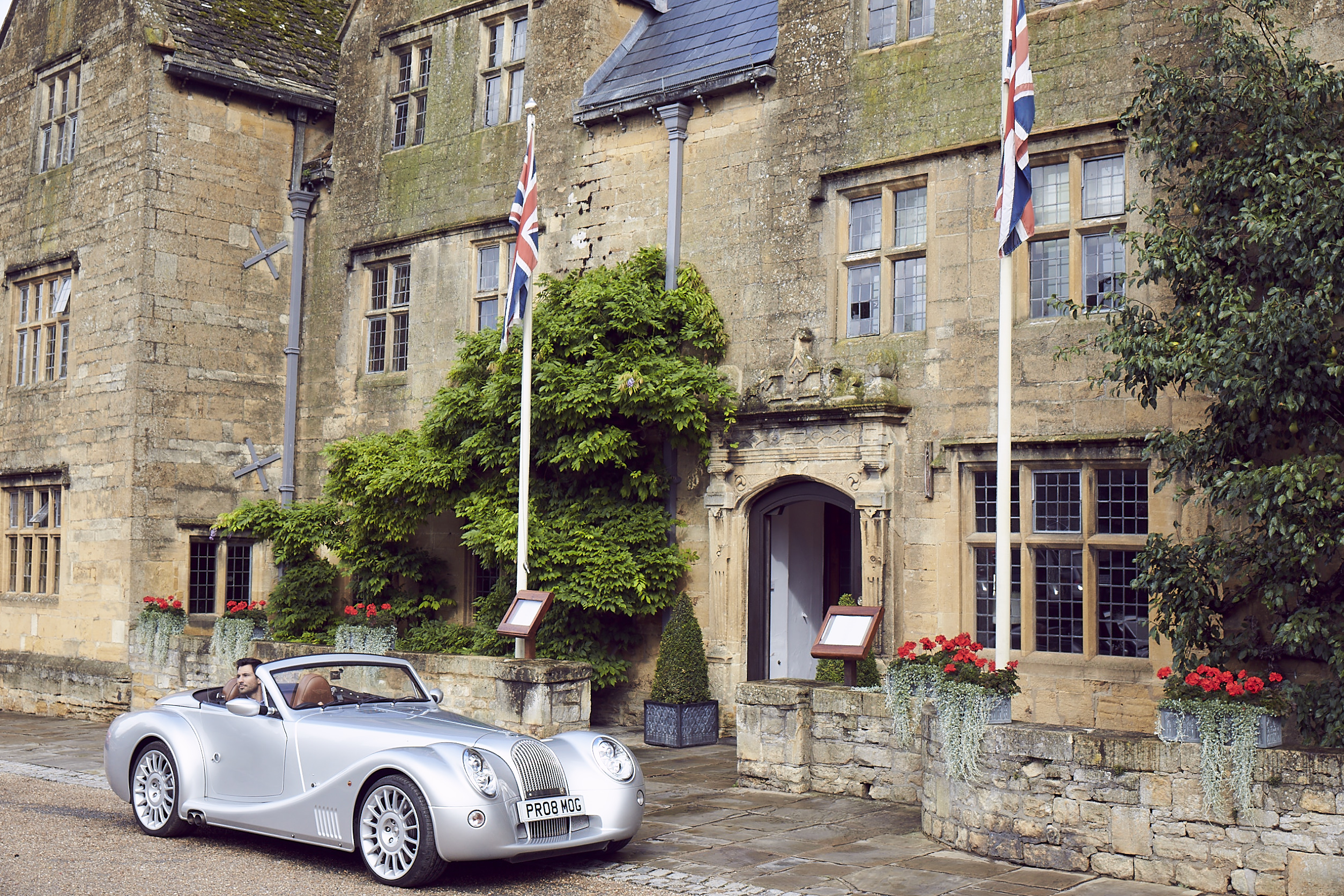 Man arriving in car outside of The Lygon Arms
