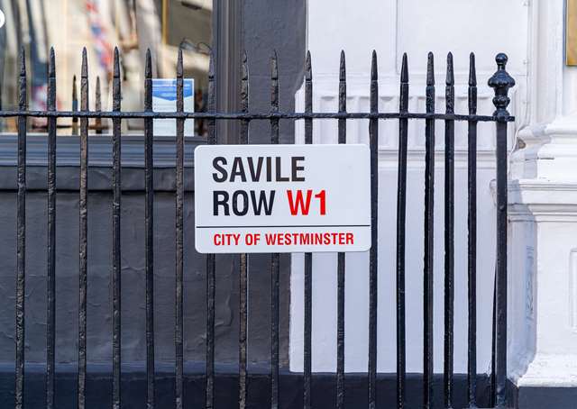 Day time view of Savile Row sign in London