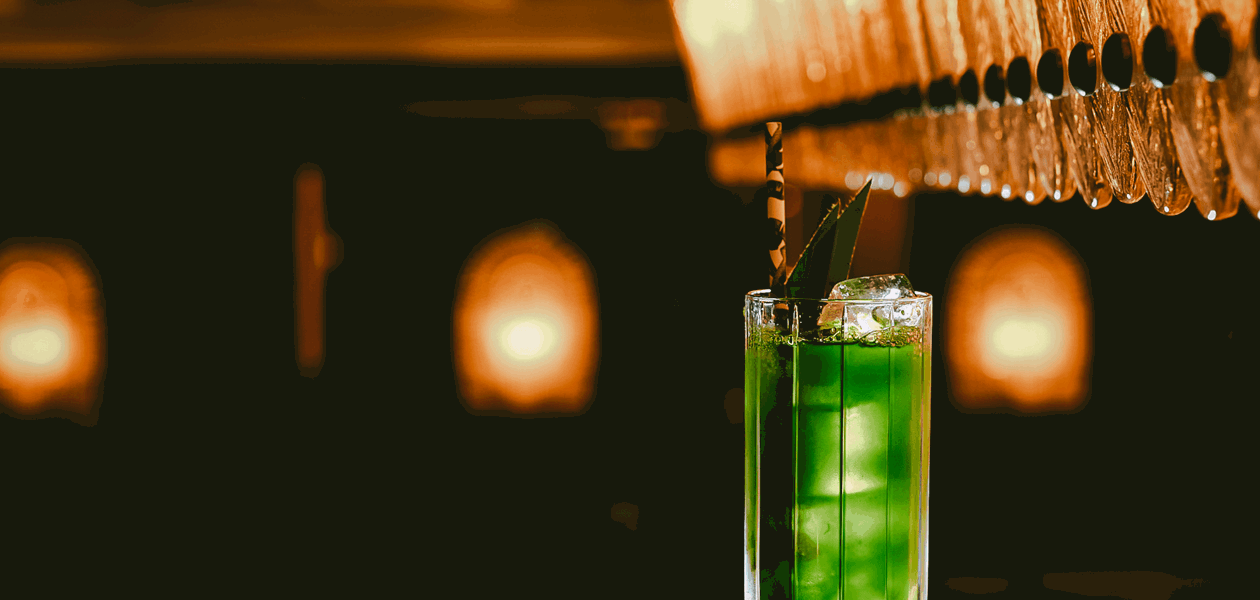 Green cocktail at The Dandy Bar at The Mayfair Townhouse