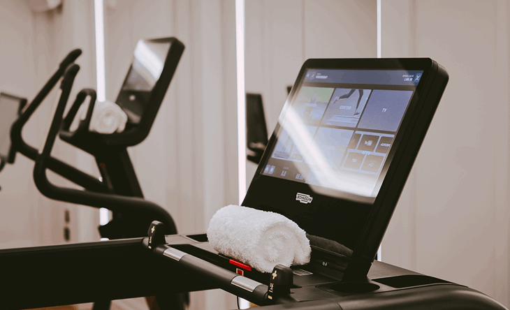 Treadmill and cross trainer inside the fitness suite at The Mayfair Townhouse